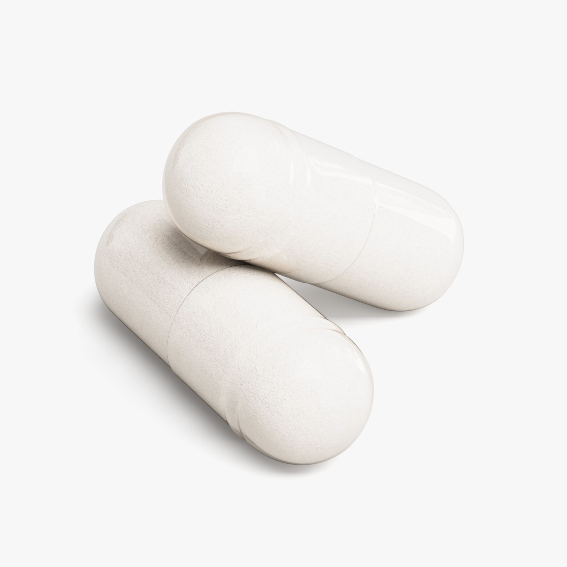 Macro close-up of two white Serni magnesium glycinate capsules